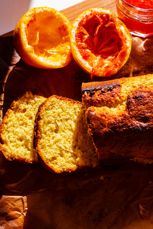 Blood orange pound cake with squeezed oranges on the side